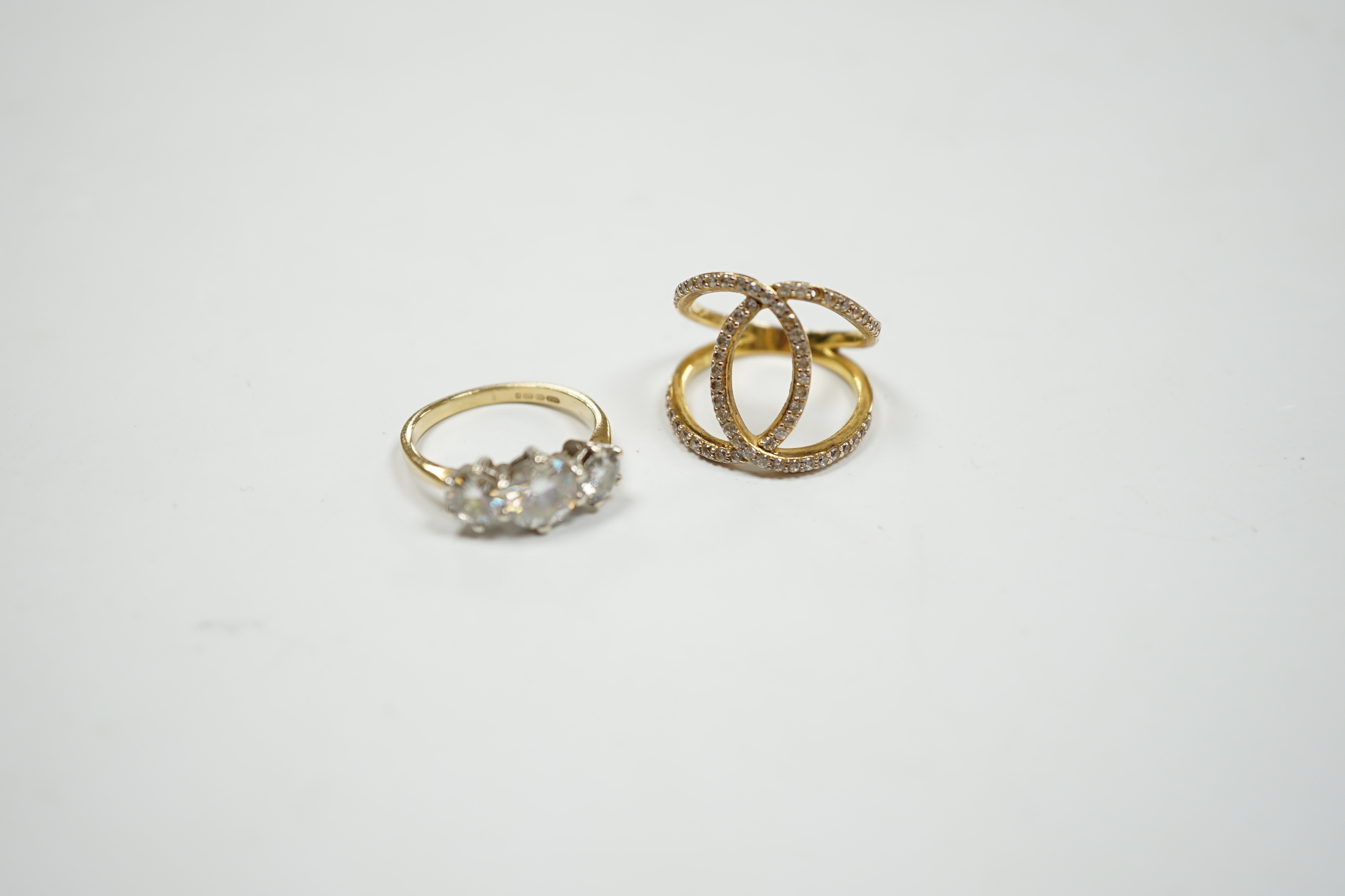 A 9ct gold and three stone simulated diamond ring and a gilt 925 ring.